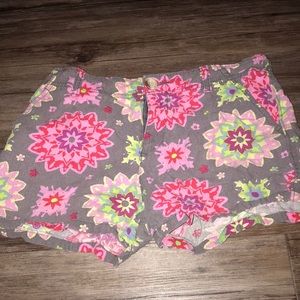 Grey shorts with multicolored flower designs